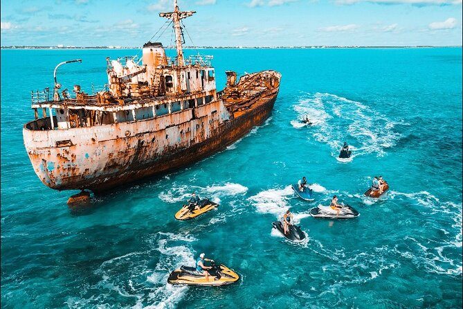 Aerial view of Jet Skis gathered beside the shipwreck