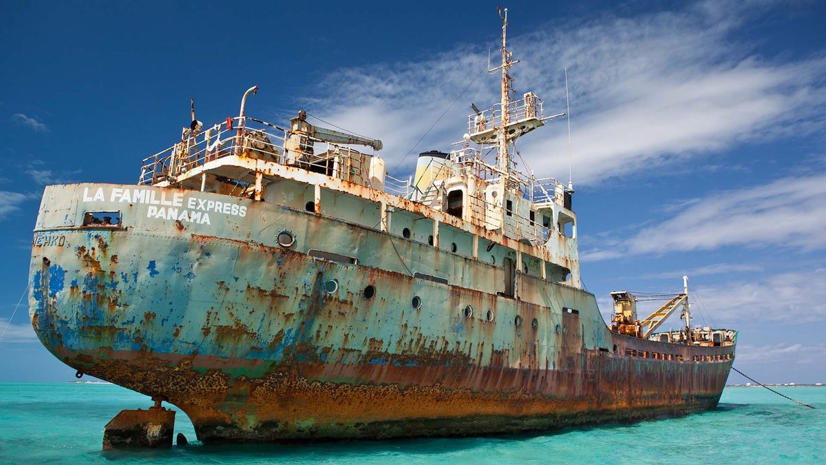 The rusted hull of the La Famille Express up close